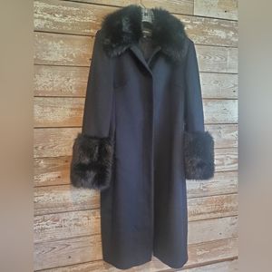 Beautiful coat 100 % wool with faux fur trim on collar and wrists.